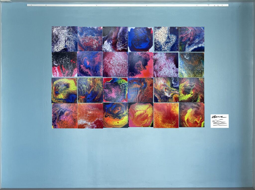 Blue wall with colorful flow art arranged in one large mass.